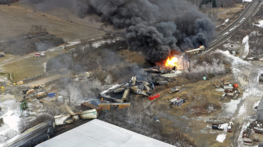 This photo taken with a drone shows portions of a Norfolk Southern freight train that derailed Frid...