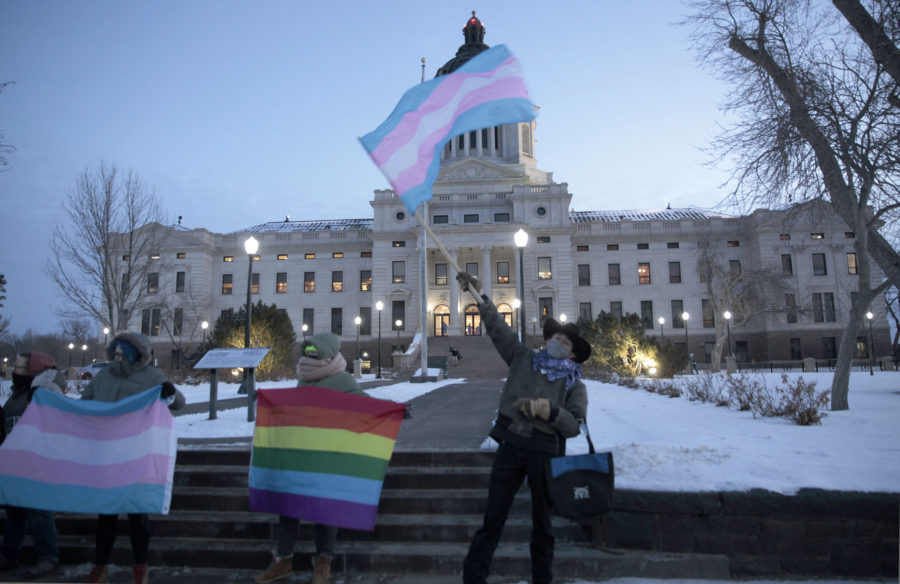 FILE - A group of LGBTQ advocates gathere outside the South Dakota Capitol in Pierre on Jan. 26, 20...