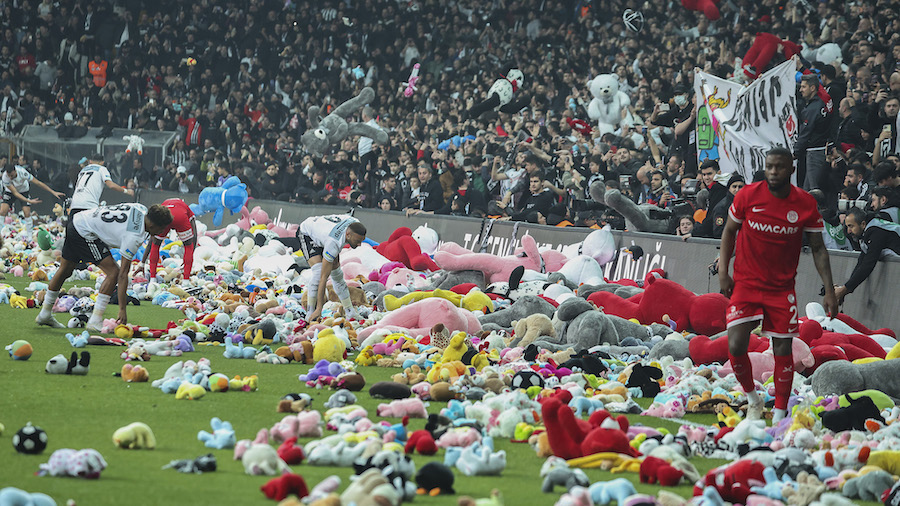 Fans throw toys onto the pitch during the Turkish Super League soccer match between Besiktas and An...