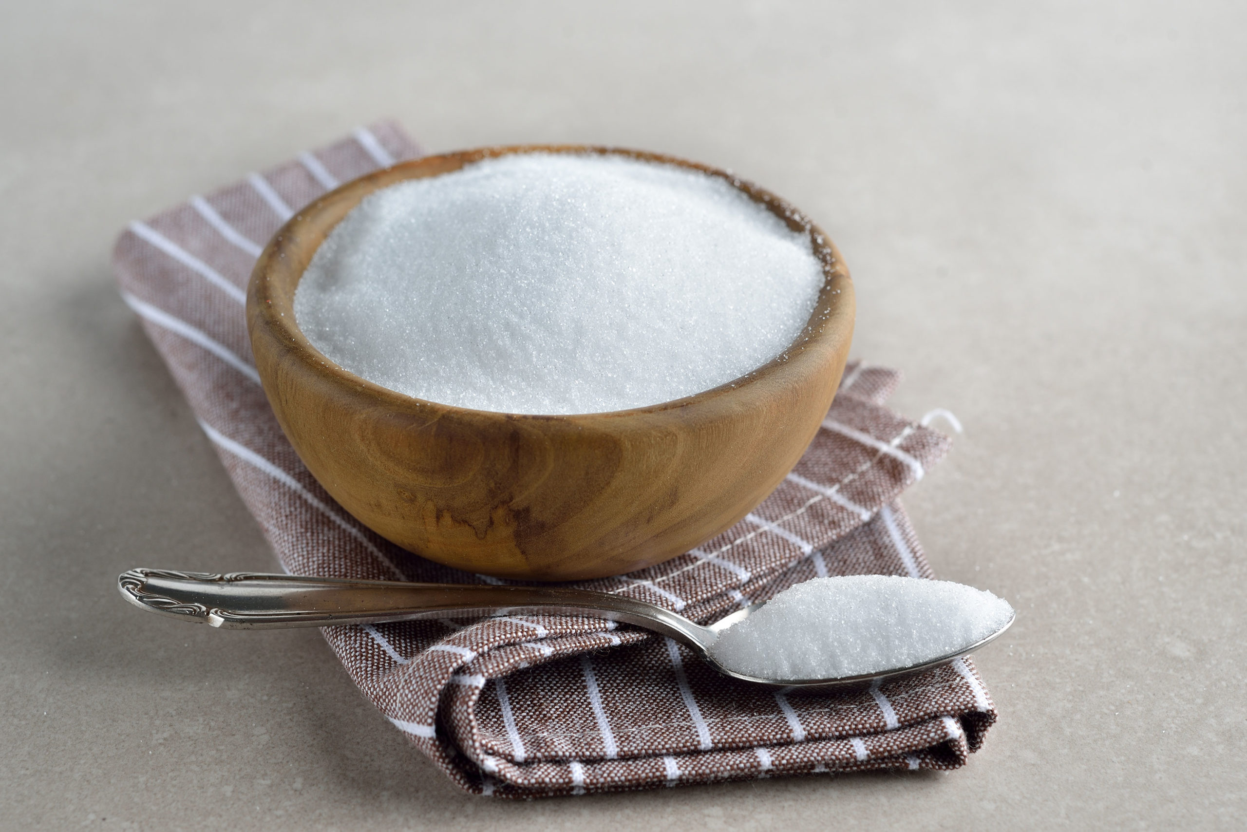 Healthy sugar substitute erythritol on a gray background...