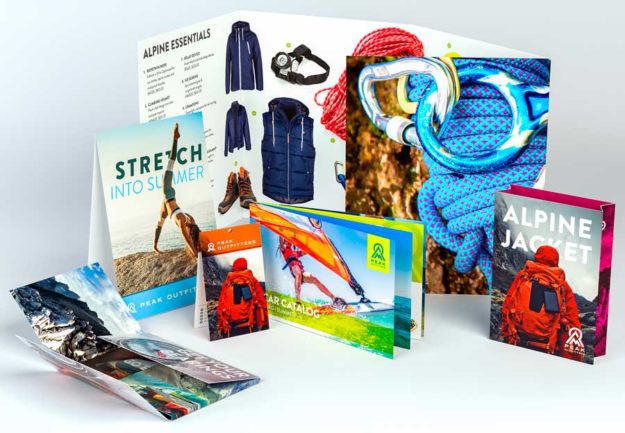 samples of print marketing materials, including a brochure, stand up calendar and postcard