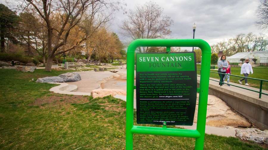 A sign indicating the Seven Canyons Fountain's water has been turned off stands in front of the fou...