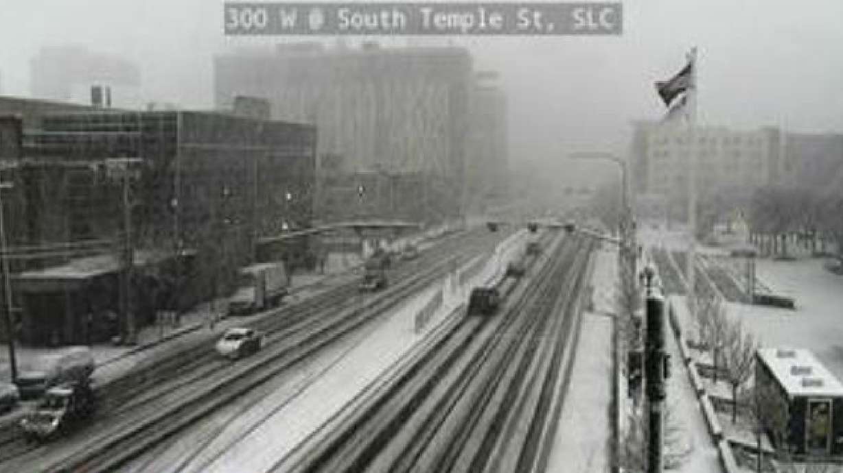Traffic cameras show 300 West and South Temple in Salt Lake Ciy covered in snow Friday. (Utah Depar...