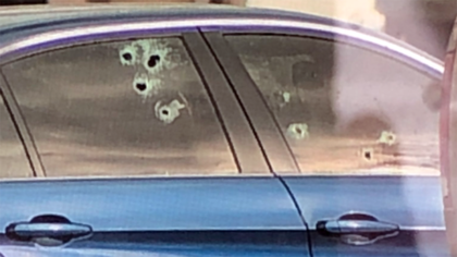 window with bullet holes