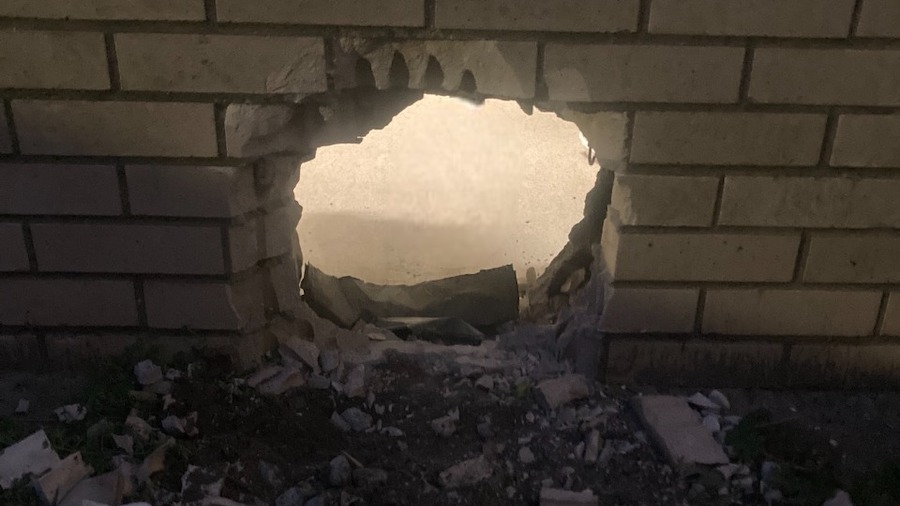 This photo provided by Newport News Sheriff's Office shows a hole in the wall of a prison cell in N...