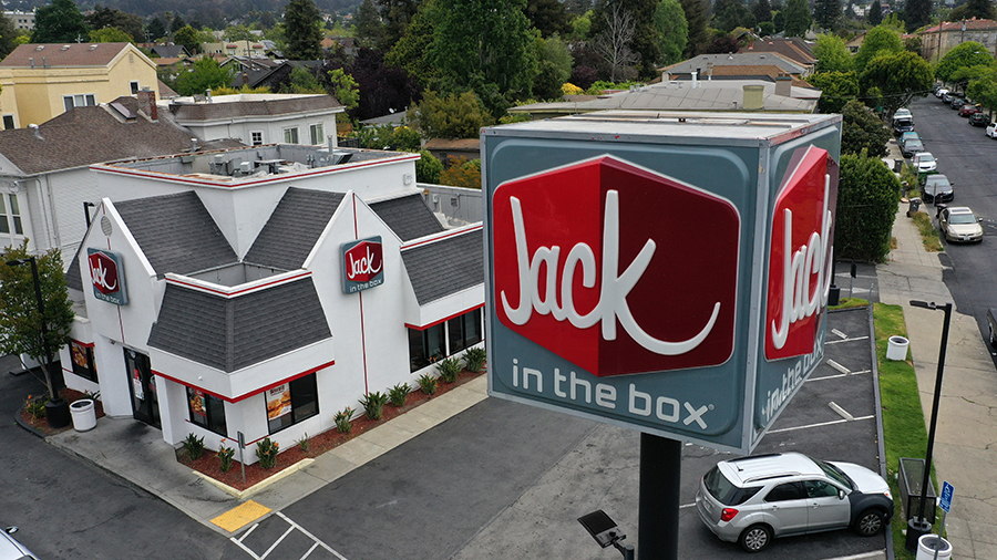 A sign is posted in front of a Jack in the Box restaurant on May 12, 2021 in Berkeley, California. ...