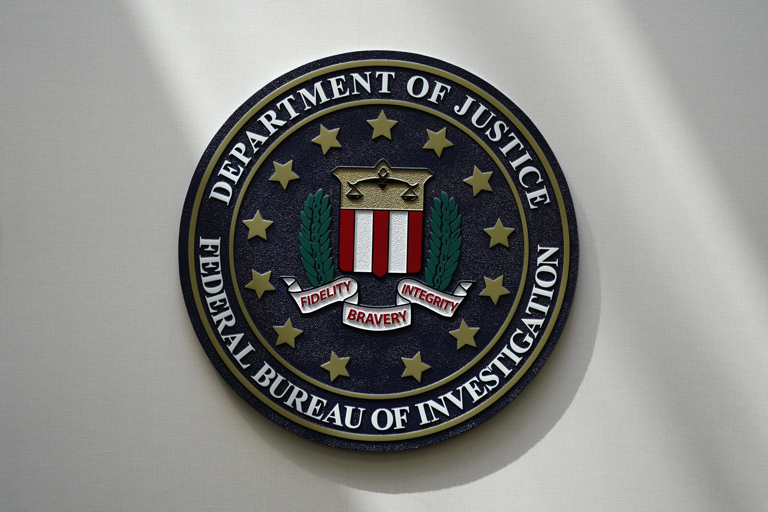 FILE - The FBI seal is pictured in Omaha, Neb., Aug. 10, 2022. The number of hate crimes in the U.S...