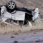 One of two cars involved in a crash sits upside down as Utah Highway Patrol and Salt Lake City Police investigate following a collision between two cars at 700 North just off of I-215 in Salt Lake City on Friday, Mar. 3, 2023. (Deseret News	/Scott G Winterton), 