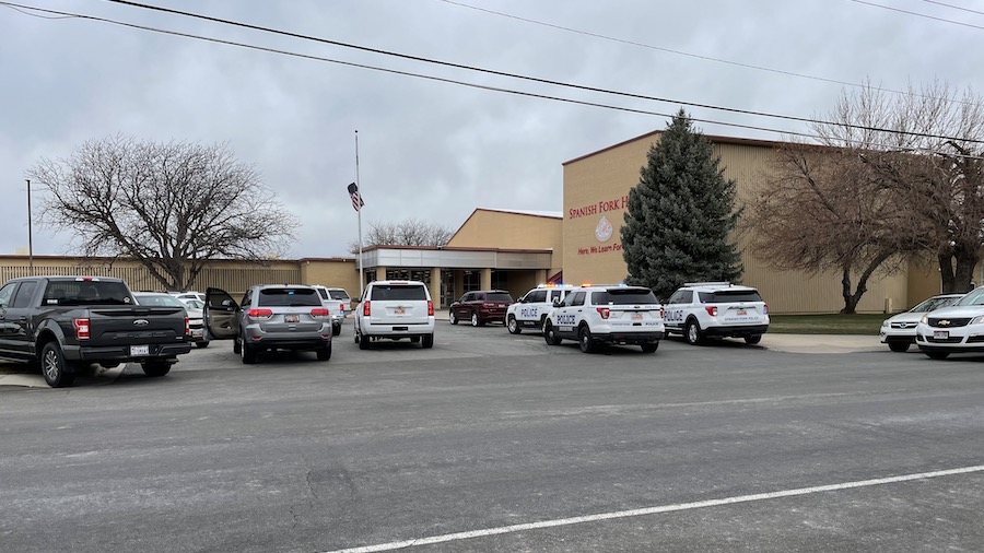 Police respond to Spanish Fork High School after receiving reports of an active shooter, which were...