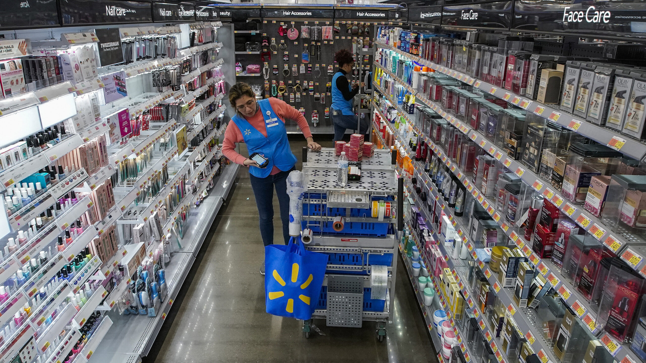 An employee organizes beauty products inside the Walmart Supercenter in North Bergen, N.J. on Thurs...