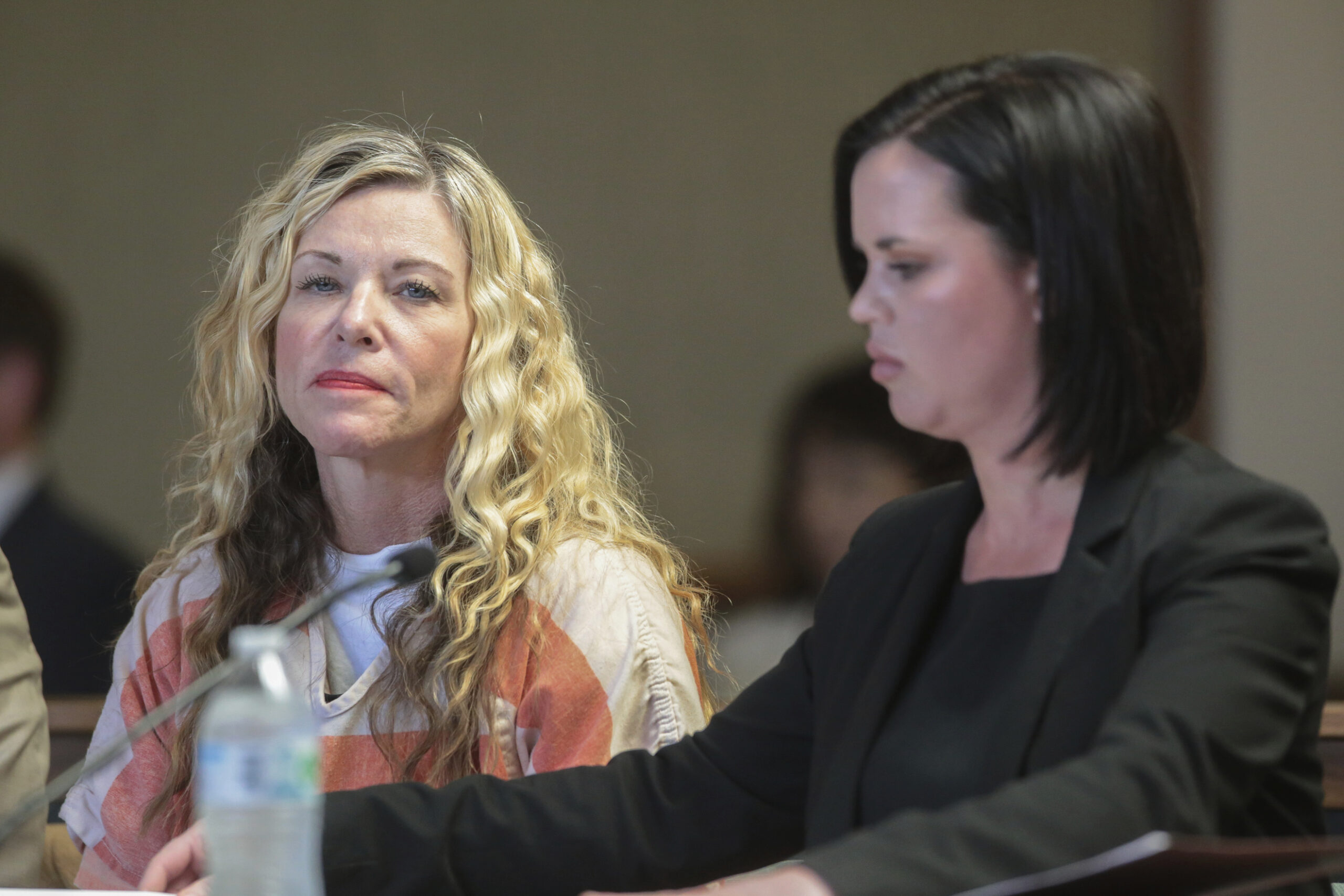 FILE - Lori Vallow Daybell glances at the camera during her hearing in Rexburg, Idaho., March 6, 20...