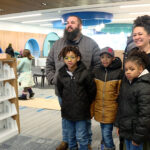 The entire Regan family showed up to help the Spanish Fork community fill the new library with books. (Mark Less/KSL TV)