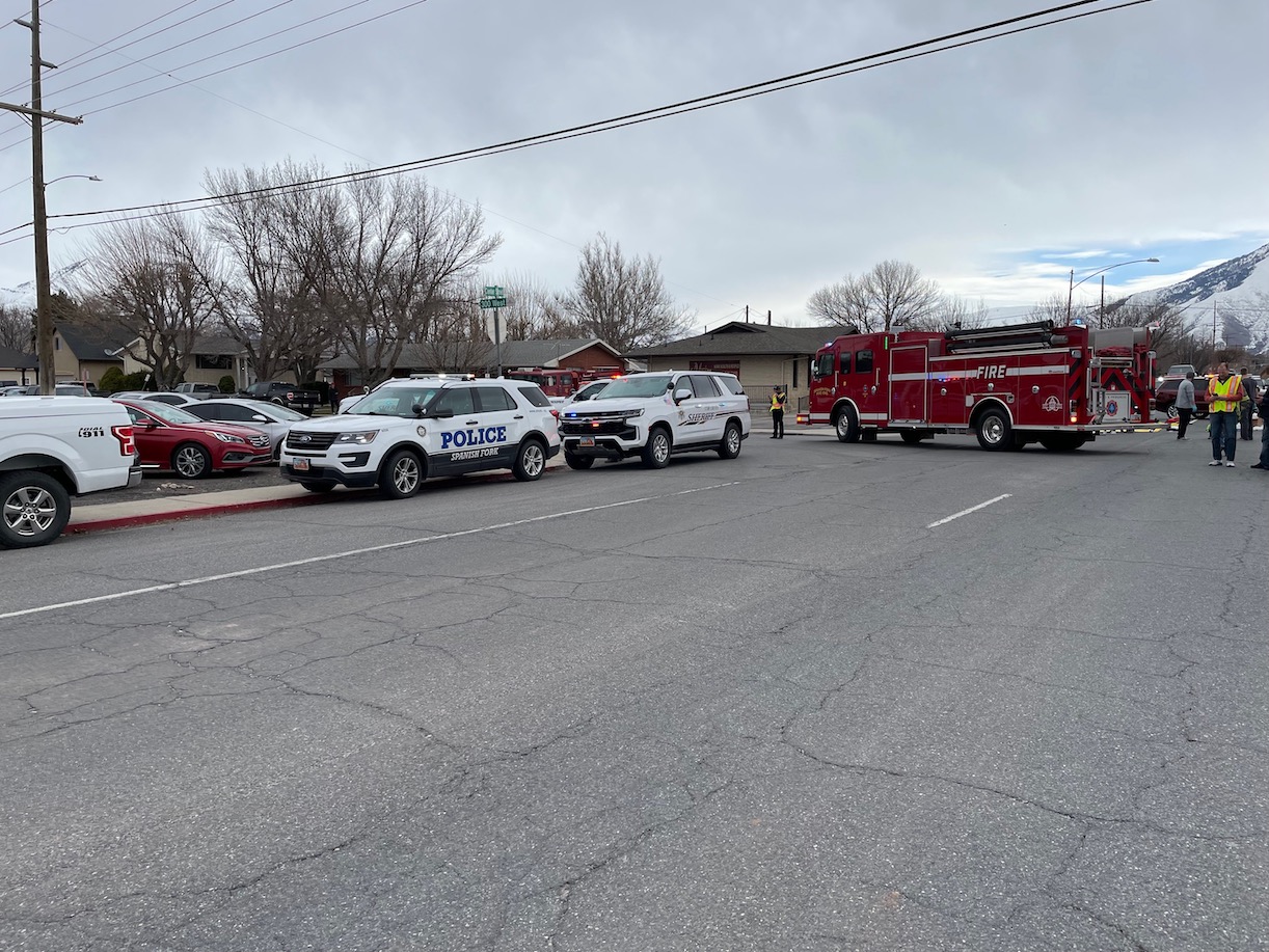 Police respond to Spanish Fork High School after receiving reports of an active shooter, which were...