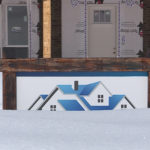 A construction sign for a home buried in snow. (KSLTV/Stuart Johnson)