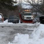 Plows had a tough time maneuvering between cars in West Jordan, Utah. (Lauren Steinbrecher/KSL TV)