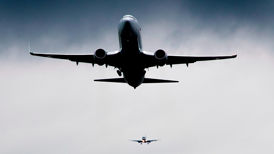 A flight takes off as another lands at Ronald Reagan Washington National Airport in Arlington, Virg...