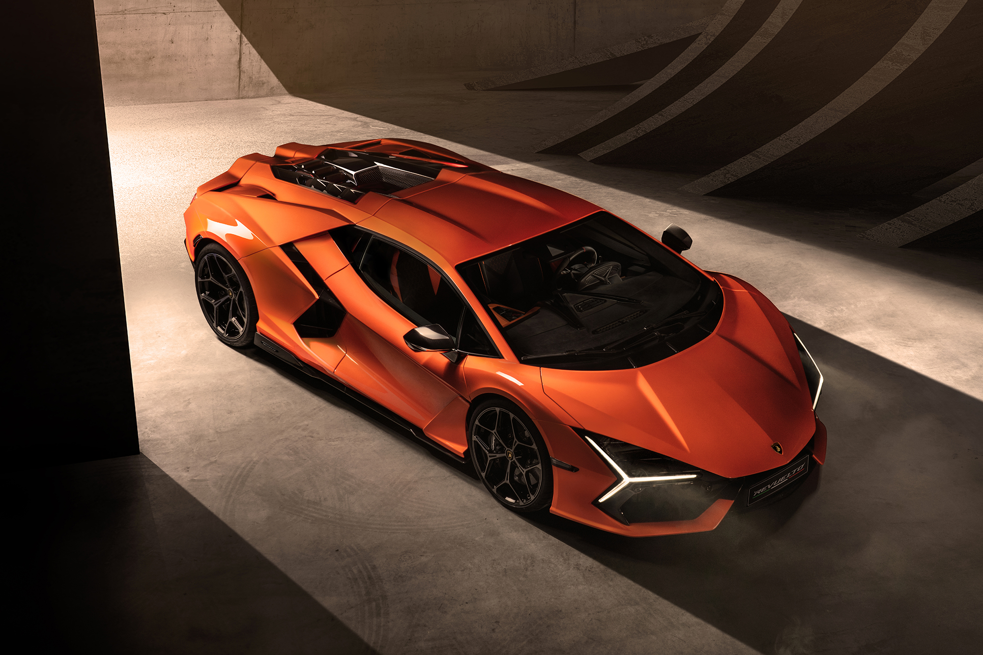 Luxury Italian sports car designer Lamborghini has unveiled its first supercar with a charging port...