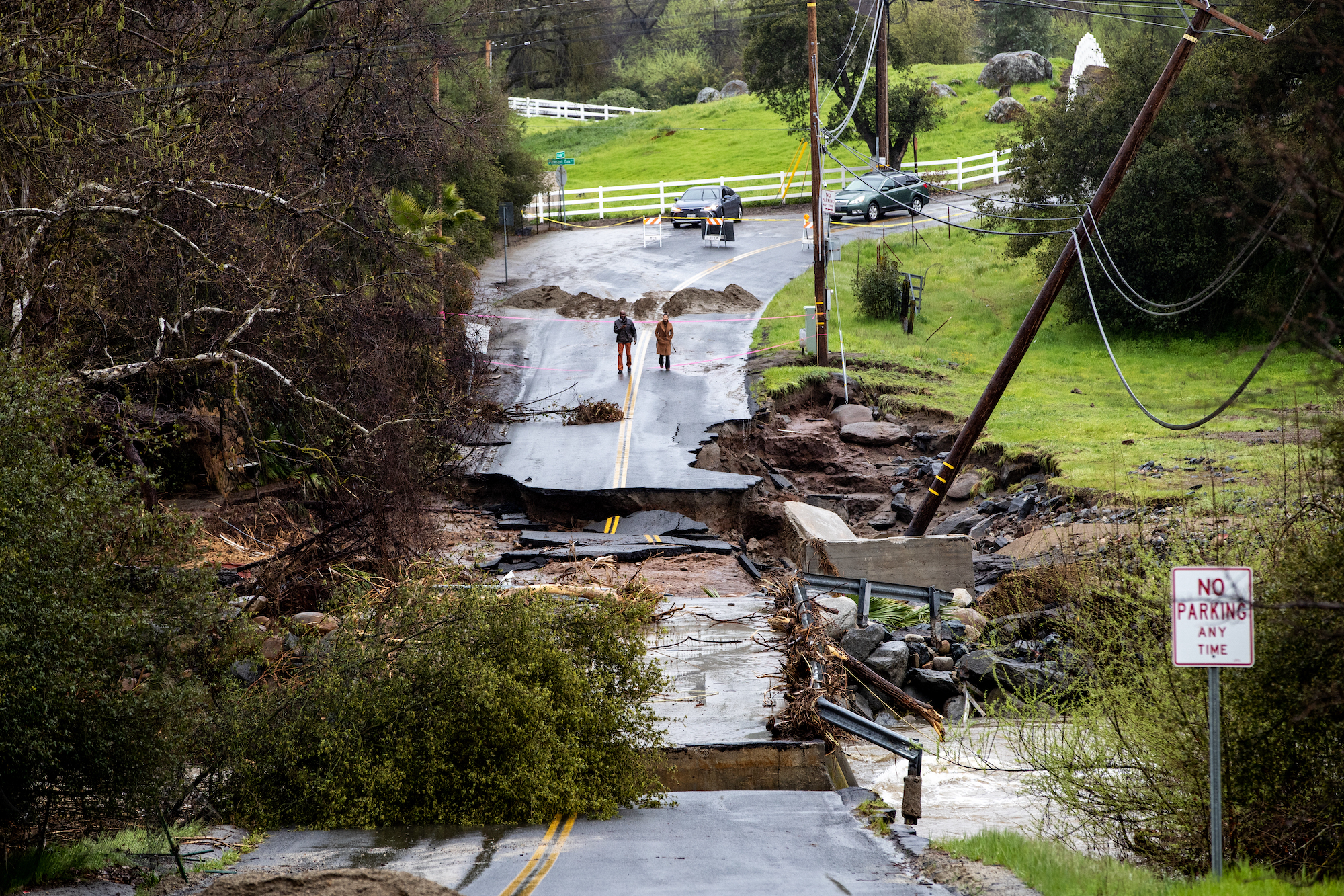 SPRINGVILLE, CA - MARCH 14, 2023: Residents checkout the damage after the fast moving and swollen T...