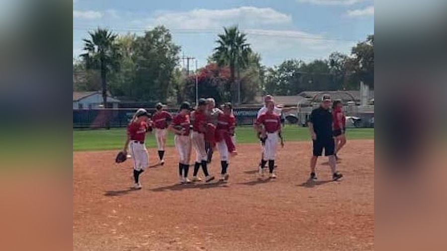 Southeastern University players carry Grand View University senior Kaitlyn Moses after she hit a gr...