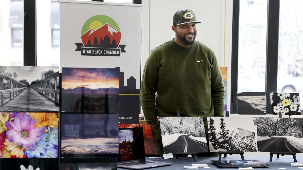 Tabarri Hamilton displays his photography at the Utah Black Chamber's "Black and Open for Business"...
