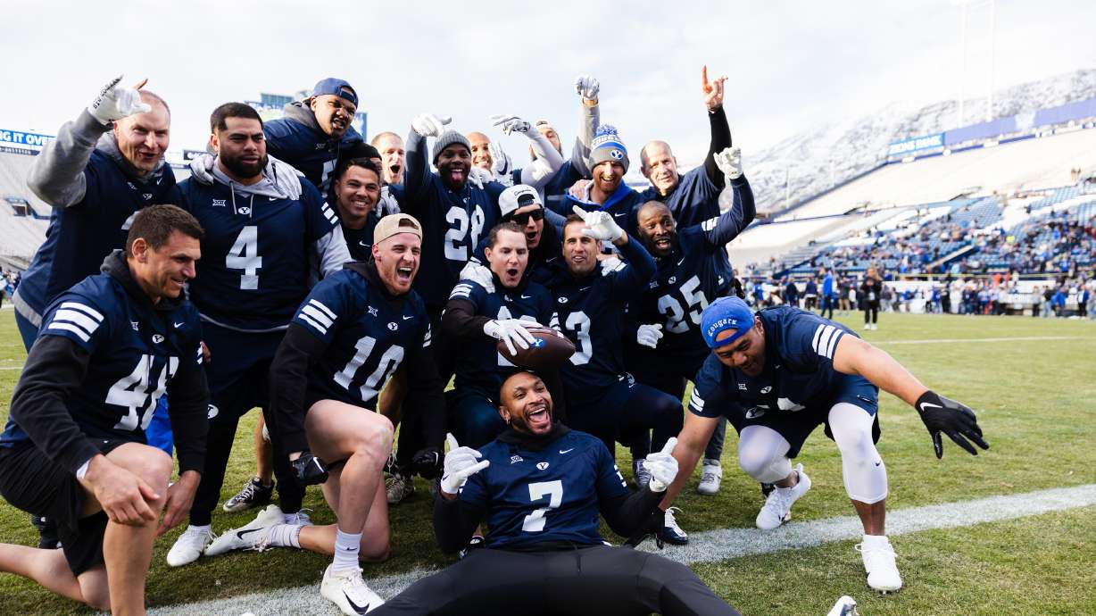 Brigham Young alumni celebrate after winning during the Brigham Young University alumni game at LaV...