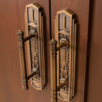 The Sapele African Mahogany interior doors of the Saratoga Springs Utah Temple are garnished with hardware that shows design details of wetland grass and water representing nearby Utah Lake. (Intellectual Reserve, Inc.)