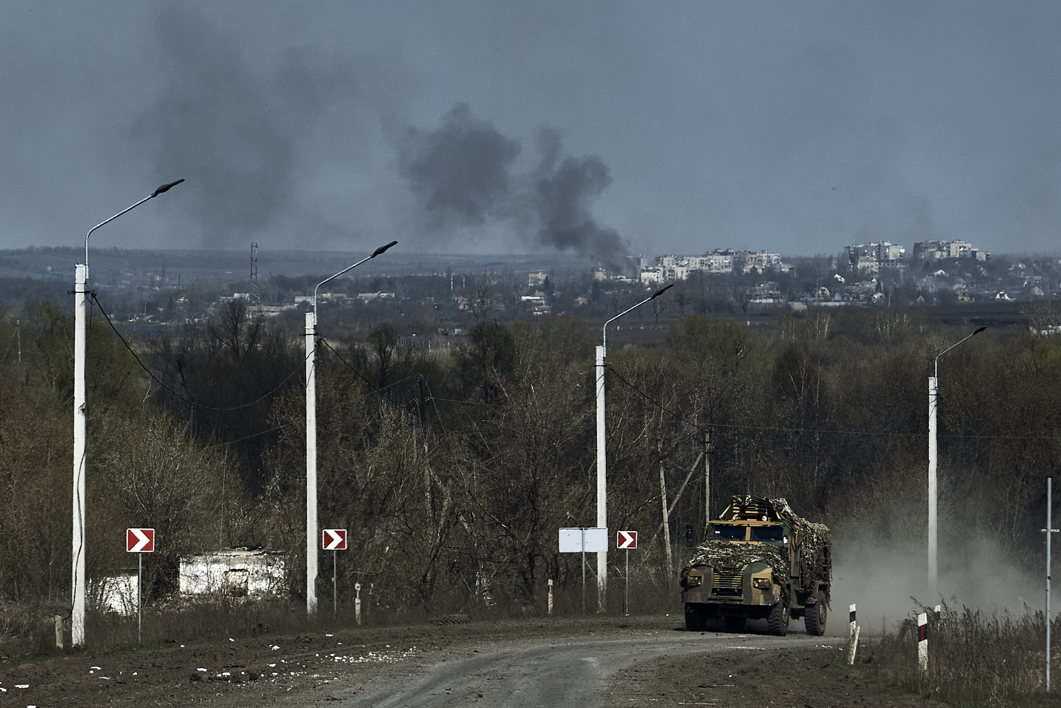 A Ukrainian APC seen on the road on the frontline in Bakhmut, Donetsk region, Ukraine, Sunday, Apri...