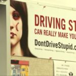 A poster reminding students to “Don’t Drive Stupid” is hanging in driver’s ed teacher Chad Lythgoe’s classroom. (KSL TV)