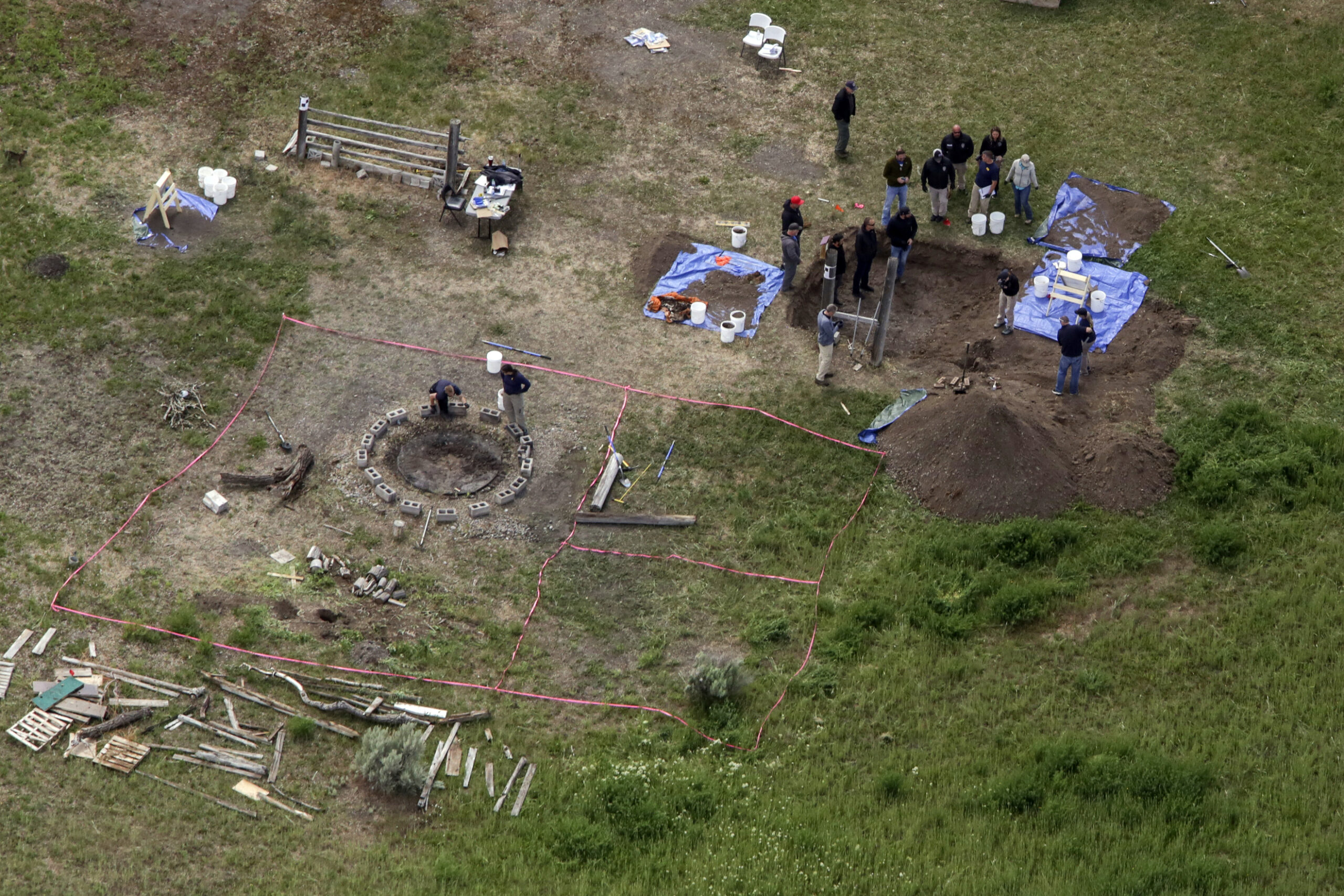 FILE - In this aerial photo, investigators search for human remains at Chad Daybell's residence in ...