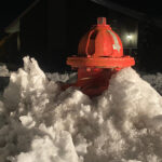 A fire hydrant is seen buried in deep snow on Main Street in Kaysville late Wednesday. (Brooke Williams)