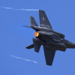 FILE - U.S. Air Force fighter aircraft F-35 performs aerobatic maneuvers on the second day of the Aero India 2023 at Yelahanka air base in Bengaluru, India, Tuesday, Feb. 14, 2023. An independent Sweden-based watchdog says the world military spending has grown for the eighth consecutive year in 2022 to an all-time high of $2240 billion leading to a sharp rise of 13% taking place in Europe, chiefly due to Russian and Ukrainian expenditure. (AP Photo/Aijaz Rahi, File)
