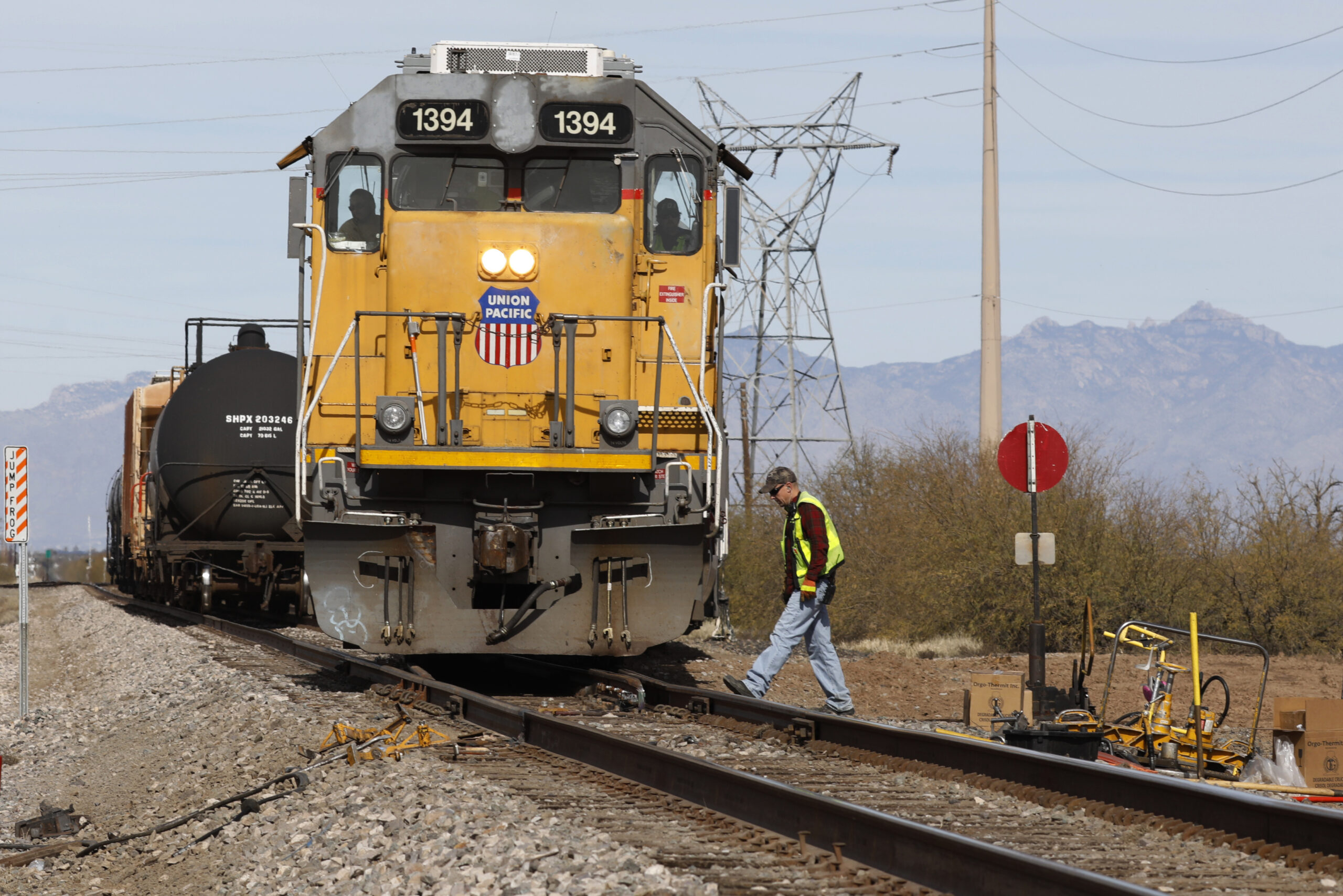 FILE - The crew on a Union Pacific freight train works at a siding area on Jan. 24, 2020, south of ...