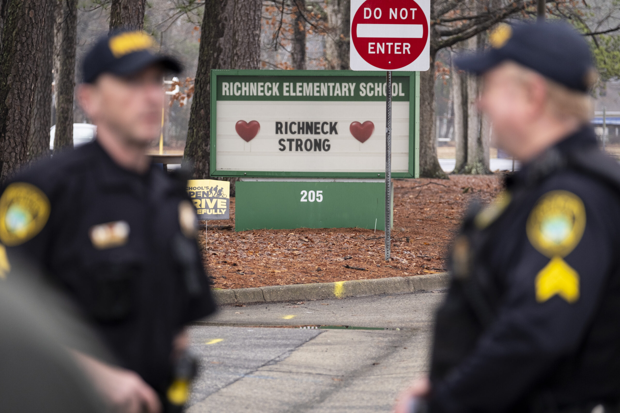 Police look on as students return to Richneck Elementary on Jan. 30, 2023, in Newport News, Va. A g...