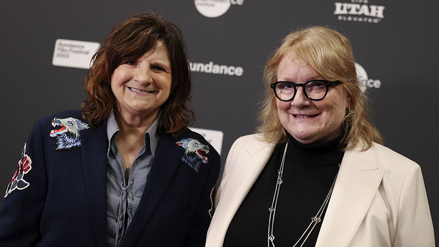 Amy Ray, left, and Emily Saliers of the Indigo Girls pose for photos at the premiere of their docum...