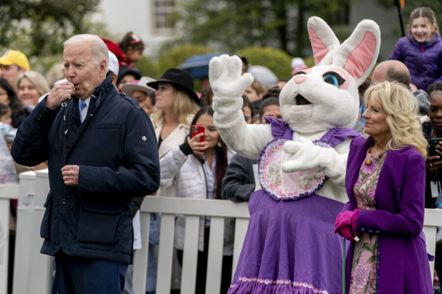 FILE - President Joe Biden, accompanied by first lady Jill Biden blows his whistle for the start of...