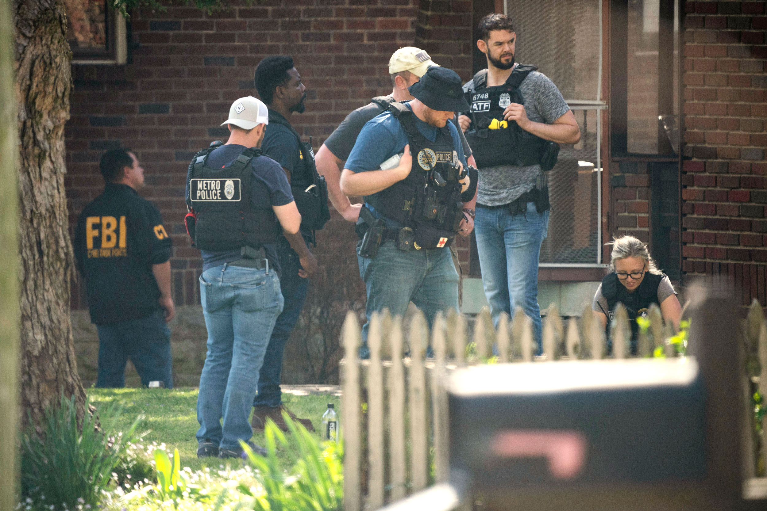 Metro Nashville Police and FBI search and investigate a house in the 3000 block of Brightwood Ave. ...