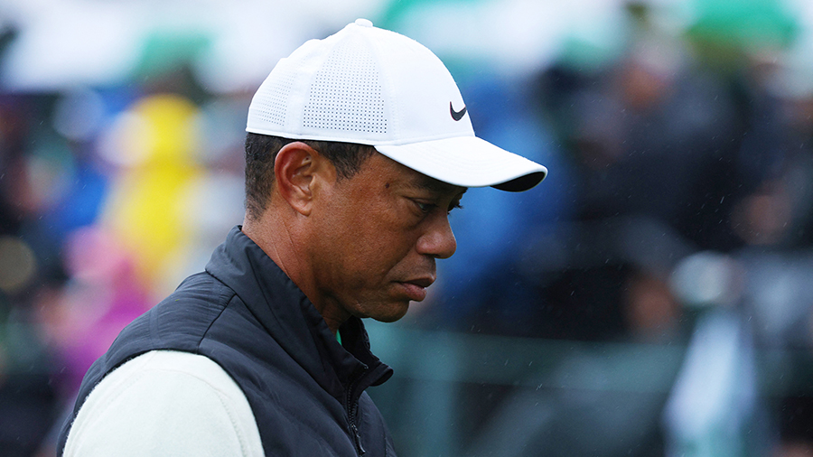 Tiger Woods of the U.S. reacts after holing his bogey putt on the 17th green during the second roun...
