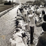 Young first-time offenders from a correctional facility heft sandbags along Sunnyside Avenue on May 16, 1984. (Tom Smart/Deseret News)