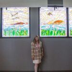 Provo artist Jeanne Gomm stands in front of her Utah Lake stained glass mural at the unveiling of the artwork at Provo Airport on April 5. 
Provo artist Jeanne Gomm stands in front of her Utah Lake stained glass mural at the unveiling of the artwork at Provo Airport on April 5. (Provo city)