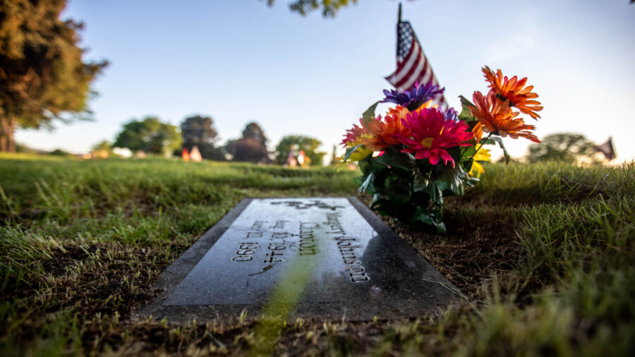 FILE: A flag is placed at Margery Johnson Clapton’s grave at Larkin Sunset Gardens Cemetery in Sa...