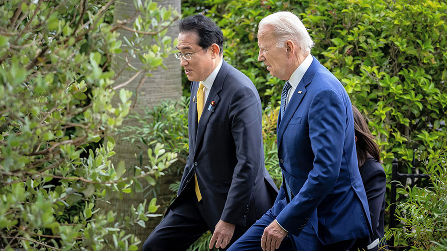 Joe Biden, President of the United States, and Fumio Kishida, Prime Minister of Japan, walk to thei...