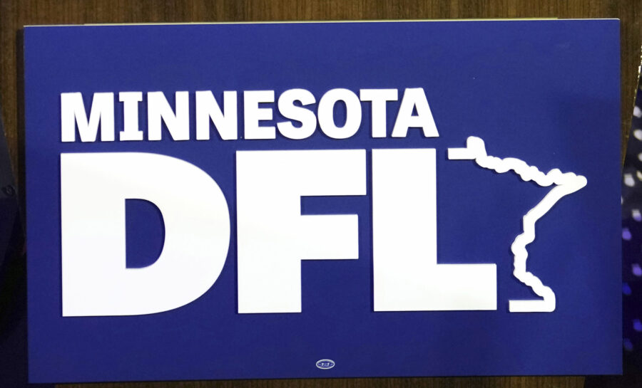 FILE - The Minnesota DFL logo appears on a podium at a DFL election-night party, Nov. 8, 2022, in S...