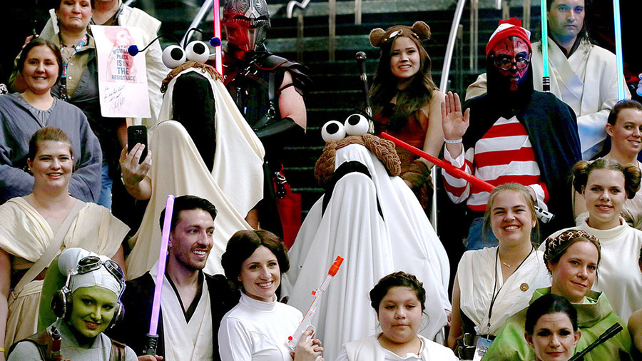 People dressed as Star Wars characters gather for a photo shoot during the Comic Con FanX event at ...
