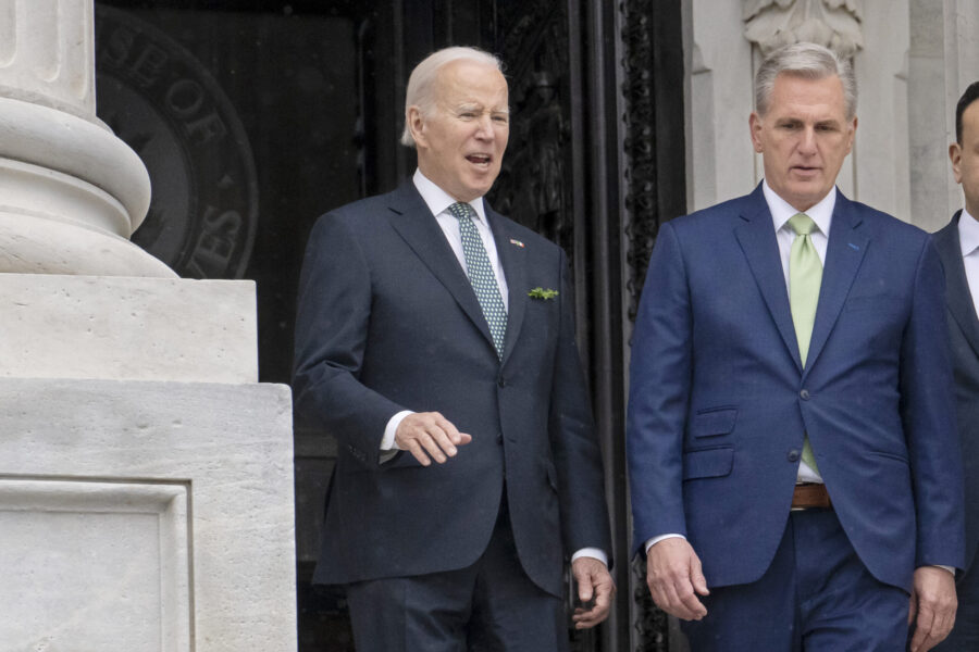 FILE - President Joe Biden talks with House Speaker Kevin McCarthy, R-Calif., as he departs the Cap...
