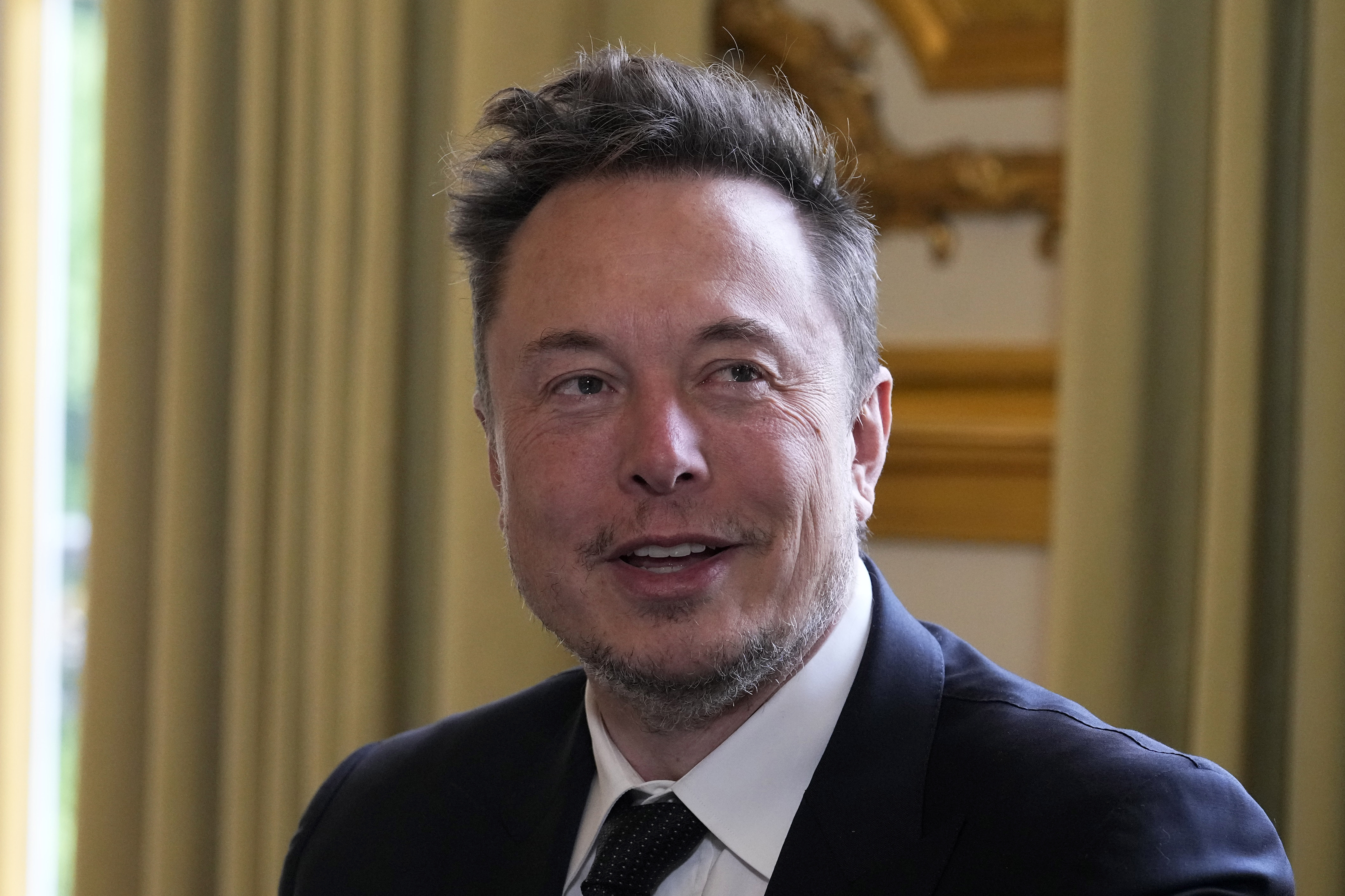 FILE - Elon Musk poses prior to his talks with French President Emmanuel Macron, May 15, 2023 at th...