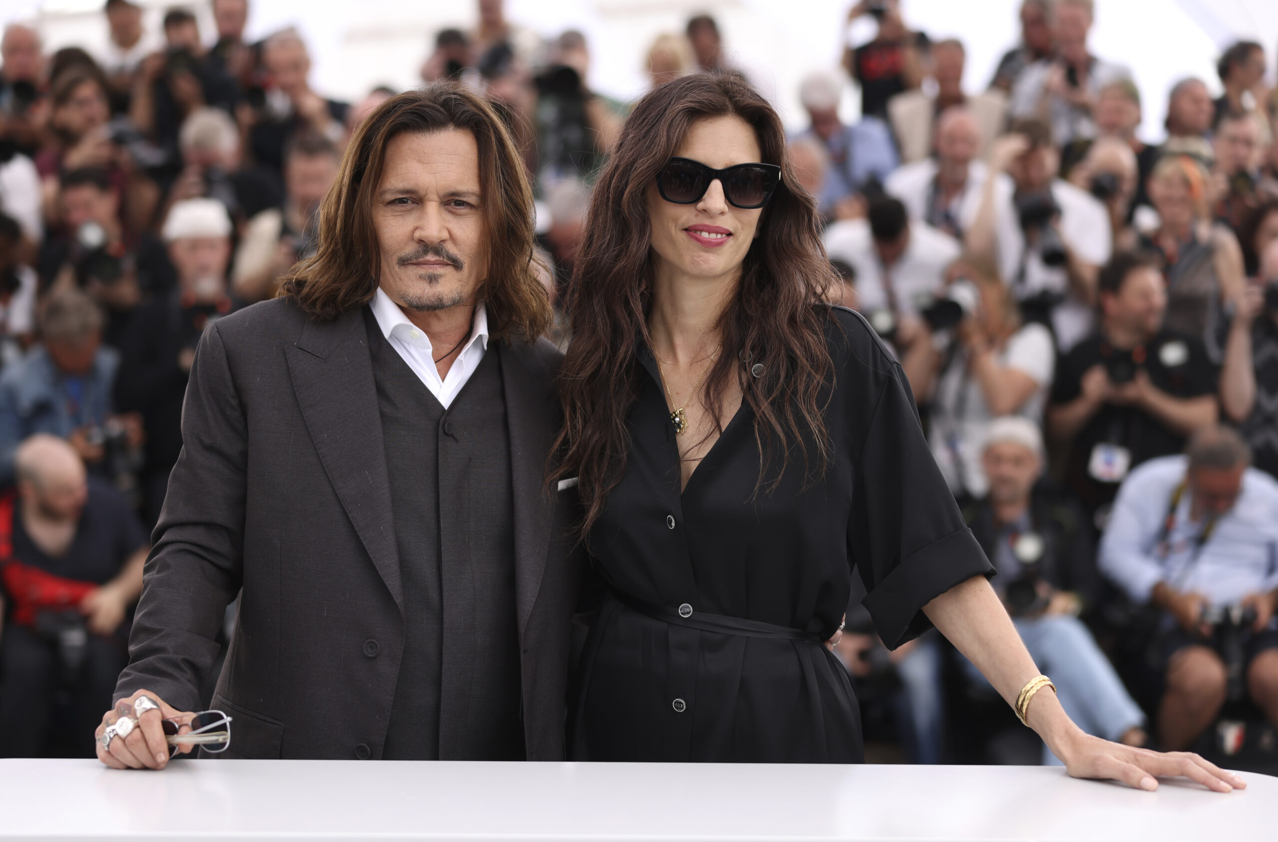 Johnny Depp, left, and director Maiwenn pose for photographers at the photo call for the film 'Jean...