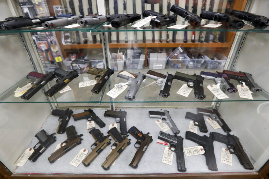 FILE - Semi-automatic handguns are displayed at shop in New Castle, Pa., March 25, 2020. A U.S. jud...