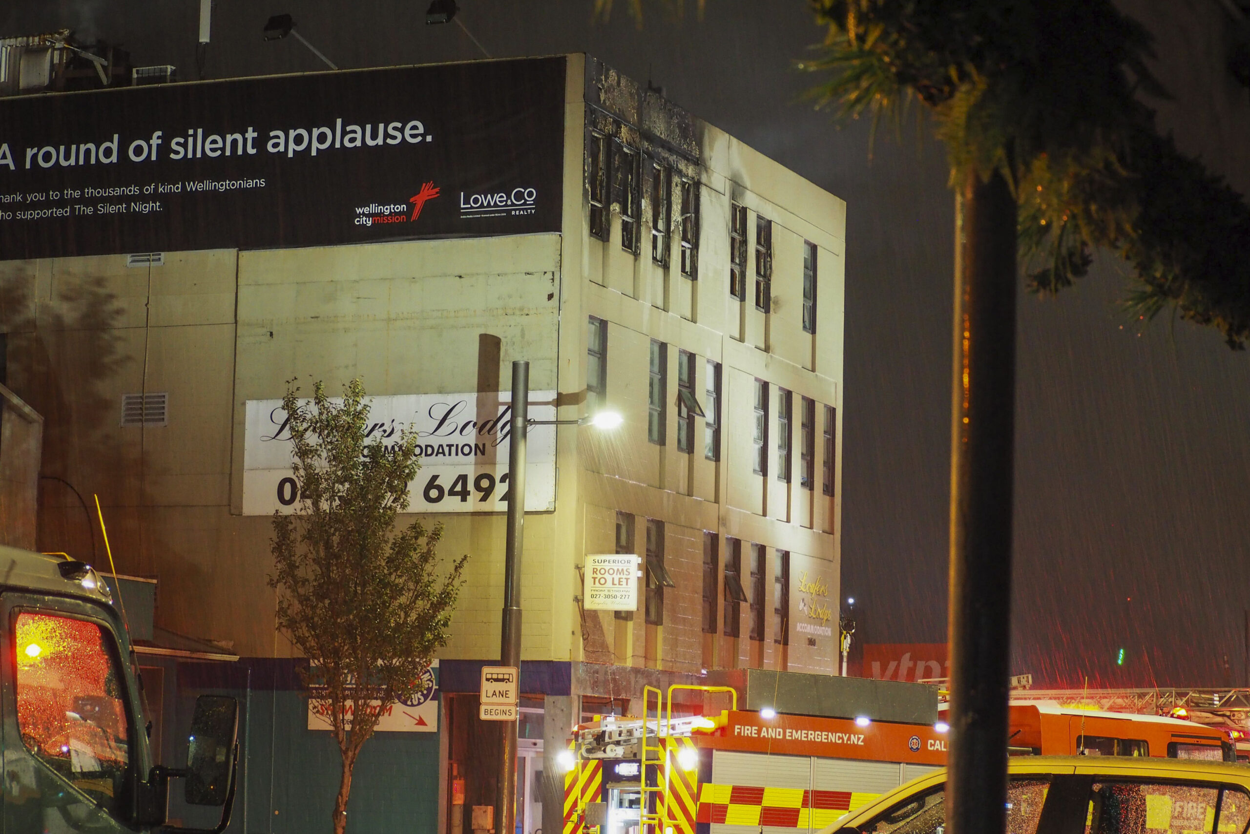 Firetrucks stage outside a fire at a hostel in central Wellington, New Zealand, Tuesday, May 16, 20...