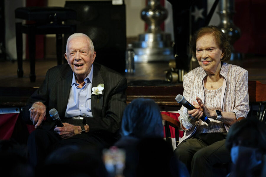 FILE - Former President Jimmy Carter and his wife former first lady Rosalynn Carter sit together du...