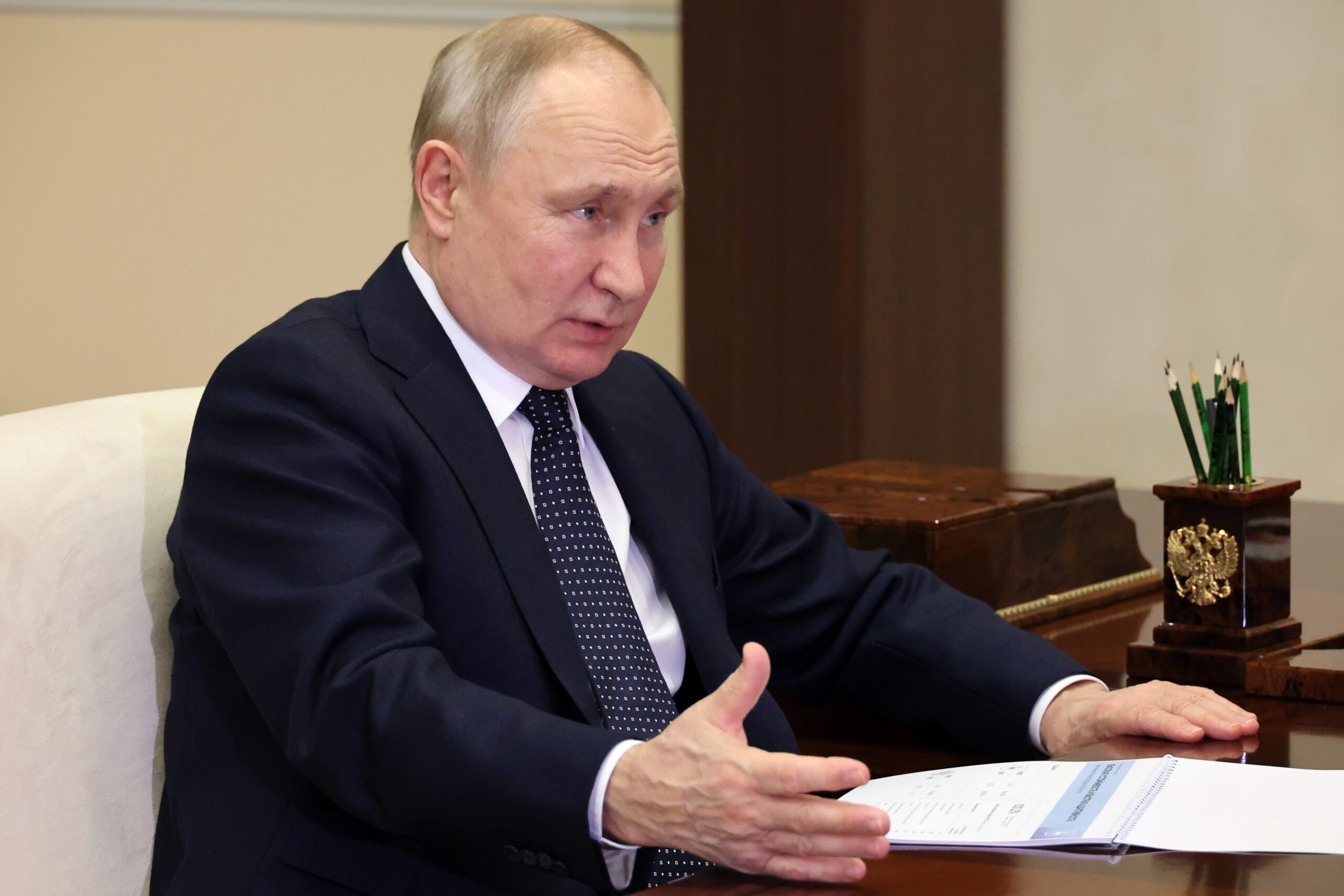 Russian President Vladimir Putin gestures while speaking to the Governor of the Nizhny Novgorod Reg...